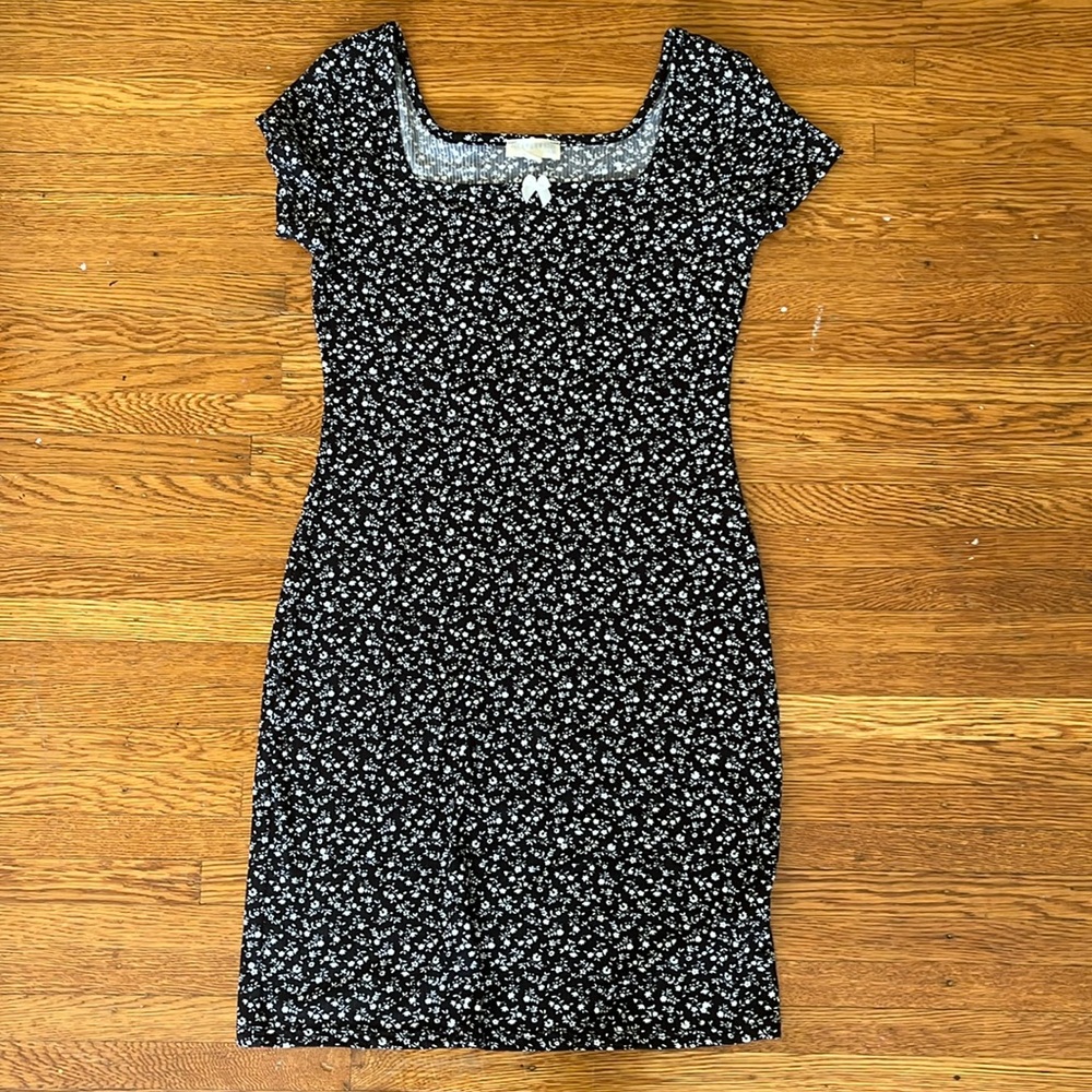 Black mini dress with white floral print and bow
